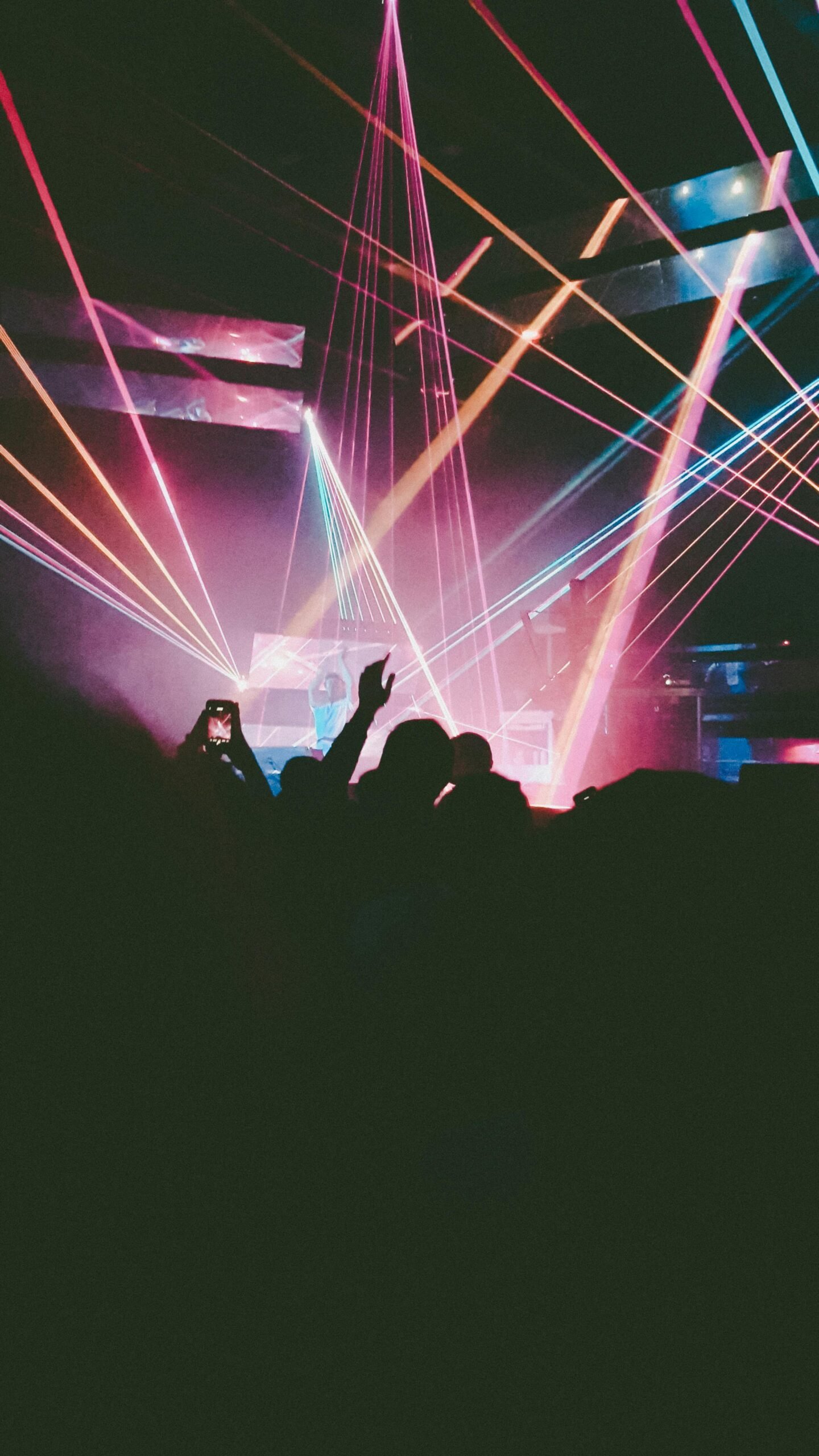 Dynamic concert scene with neon lights and crowd in Antwerpen, Belgium.